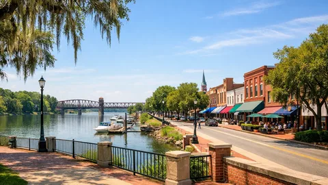 Aerial view of Augusta National Golf Club during Masters Tournament week with blooming azaleas and patrons