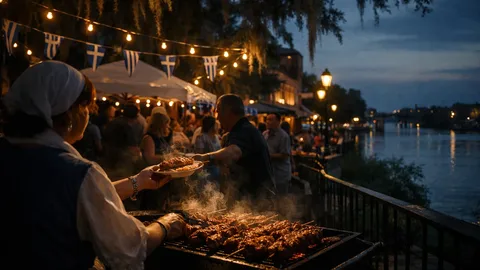Spring Greek Festival white tents along Augusta Riverwalk with visitors enjoying food and traditional music performances